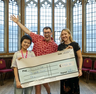 Lumi Long, William Terry-Wright and Weronika Stelmach with winning cheque